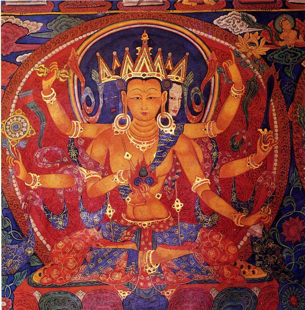 Tibet Guge 09 Tsaparang Demchog Temple 05 Ratnasambhava Along the back wall is the cycle of Akshobhya (Guhyasamaja), the five Tathagatas each with three heads and six arms, garbed in rich bodhisattva ornaments and crowns. On the far left of the wall is my favourite, a beautiful Ratnasambhava, painted in Kashmiri style with the faces and bodies elongated, the waists are very narrow, and the abdomens slightly bulging. They have well-developed, almost breast-like pectoral muscles, although their multiple arms are thin and spidery. Photo - Weyer/Aschoff: Tsaparang, Tibets Grosses Geheimnis,